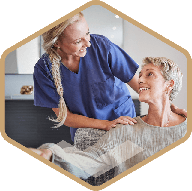 Caregiver with an elderly resident smiling